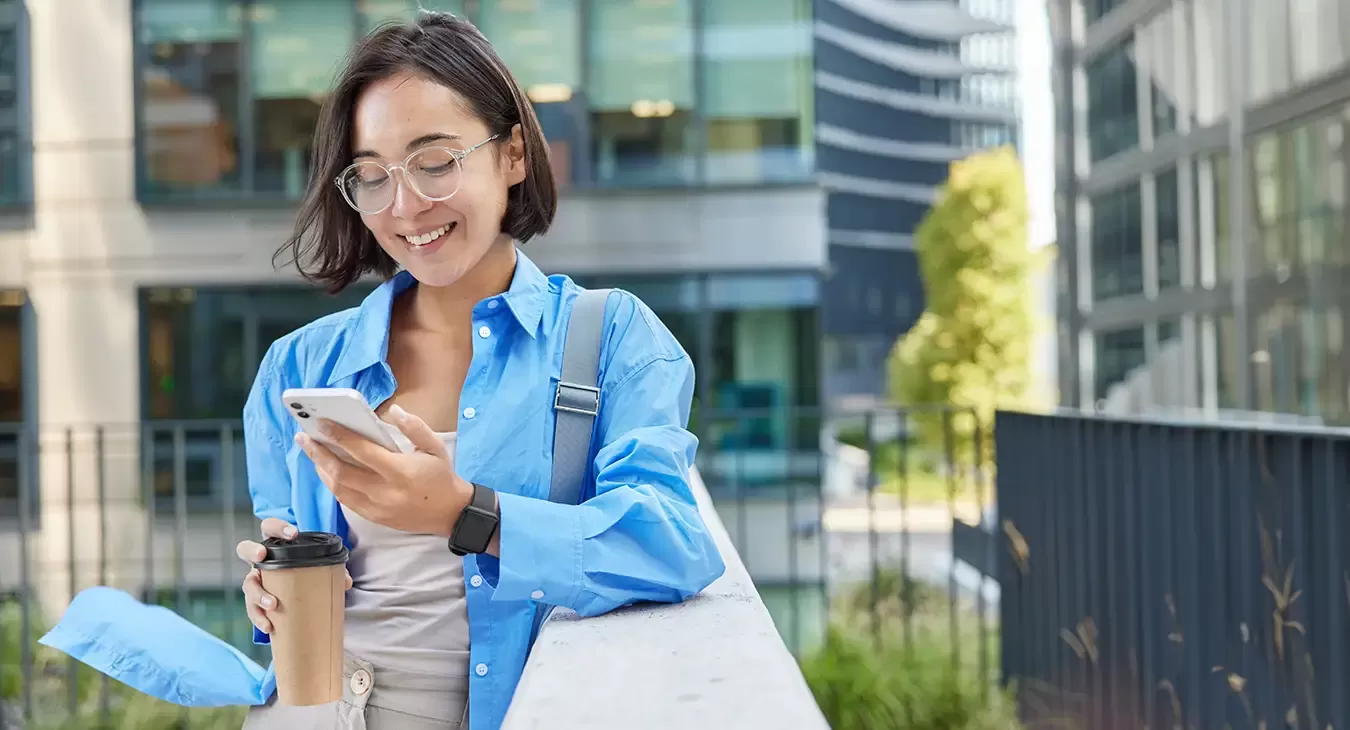 Photo of a woman looking at her mobile phone