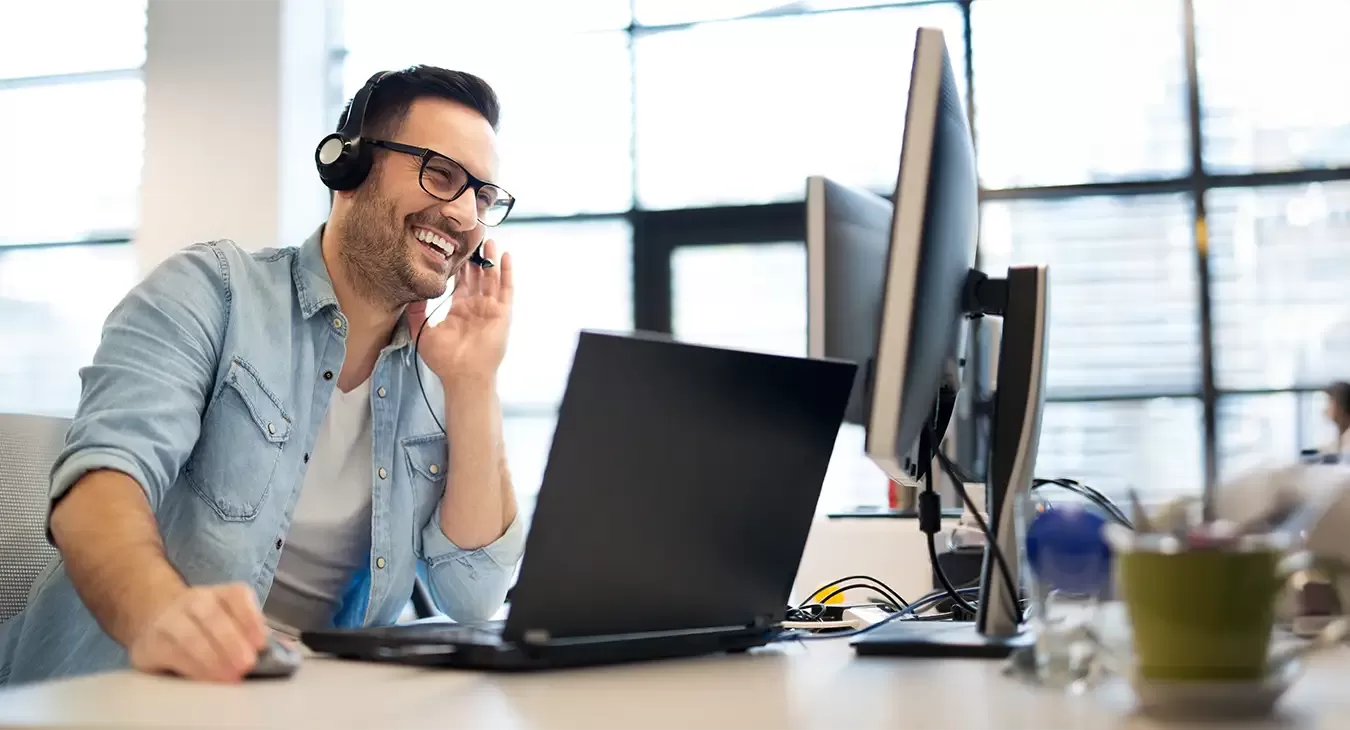 A photo of a man talking on the phone